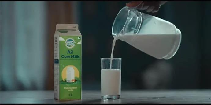 Milk Carton and milk being poured